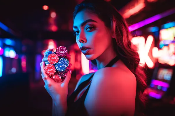 A dramatic shot of winning sevens landing on a slot reel surrounded by shining gold coins, symbolizing big wins.